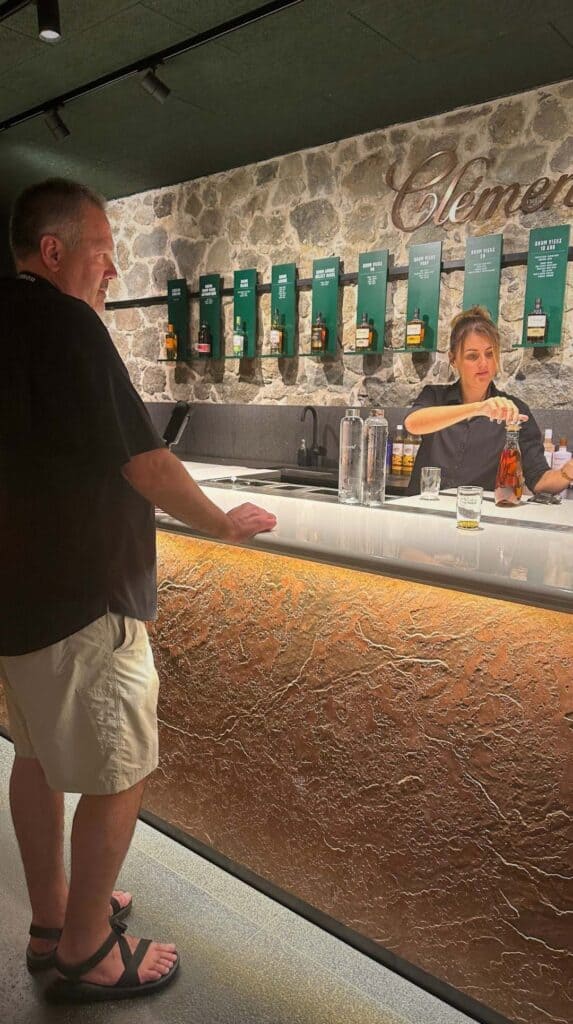 Bartender pouring a tasting sample at the Clément rhum agricole Martinique distillery bar