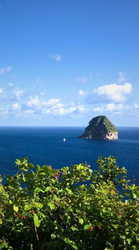 Volcanic rock island rising from the deep blue Caribbean Sea off Martinique island