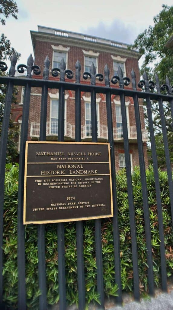 National Historic Landmark plaque on the iron fence of the Nathaniel Russell House, a top pick for couples in Charleston
