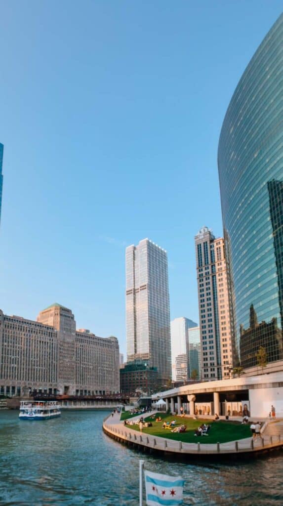 Skyline and riverfront lawn viewed from a best chicago architecture boat tour vessel