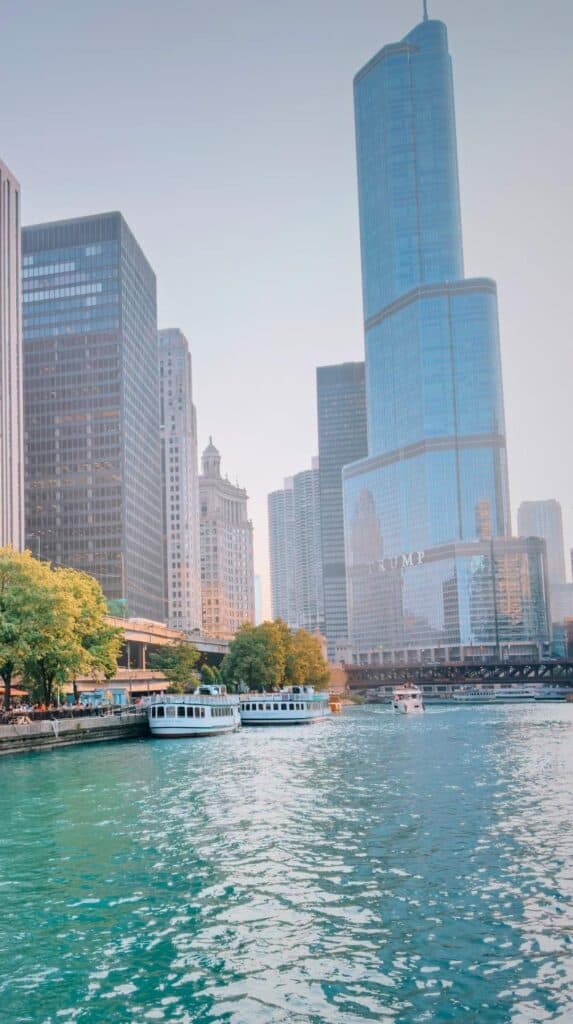 Trump Tower reflected in the river during a chicago river boat architecture tour