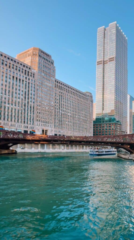 Classic wooden boat and skyline at the dock for a 45 minute architecture boat tour chicago