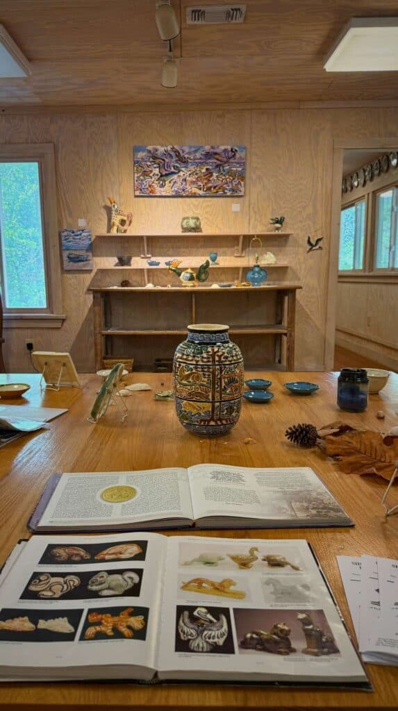 Display of handcrafted pottery pieces inside Shearwater Pottery in Ocean Springs Mississippi showcasing locally made ceramics and artistic tradition.