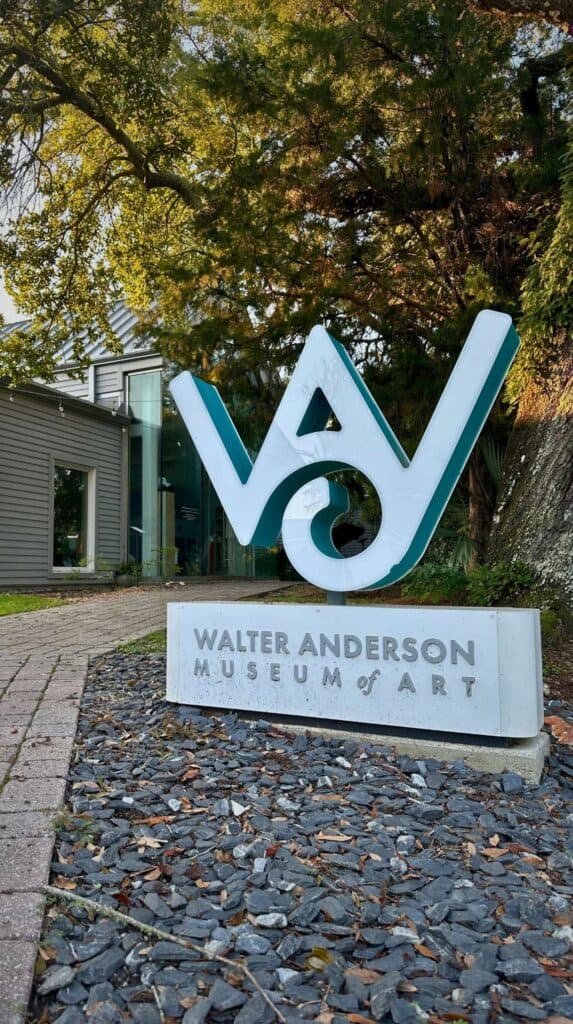 Exterior of the Walter Anderson Museum of Art in Ocean Springs Mississippi with greenery and a coastal cottage style building, a must visit stop for art lovers exploring downtown Ocean Springs.