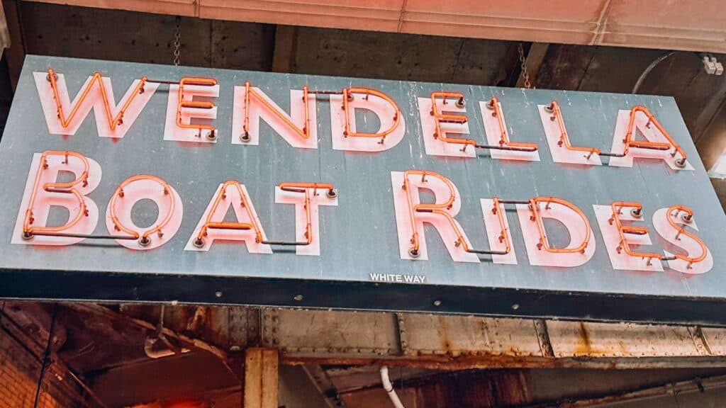 Vintage neon Wendella Boat Rides sign marking the windy city boat tours company