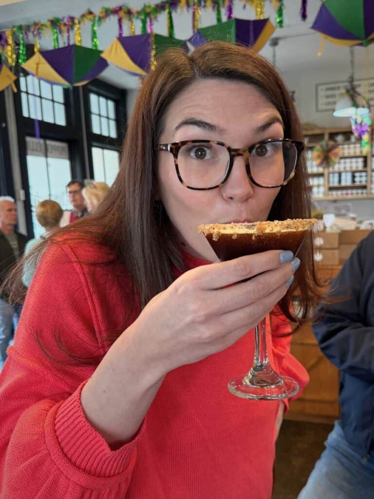 Our daughter sips a graham-rimmed espresso martini at one of the fun places to eat in Ocean Springs, MS at night.