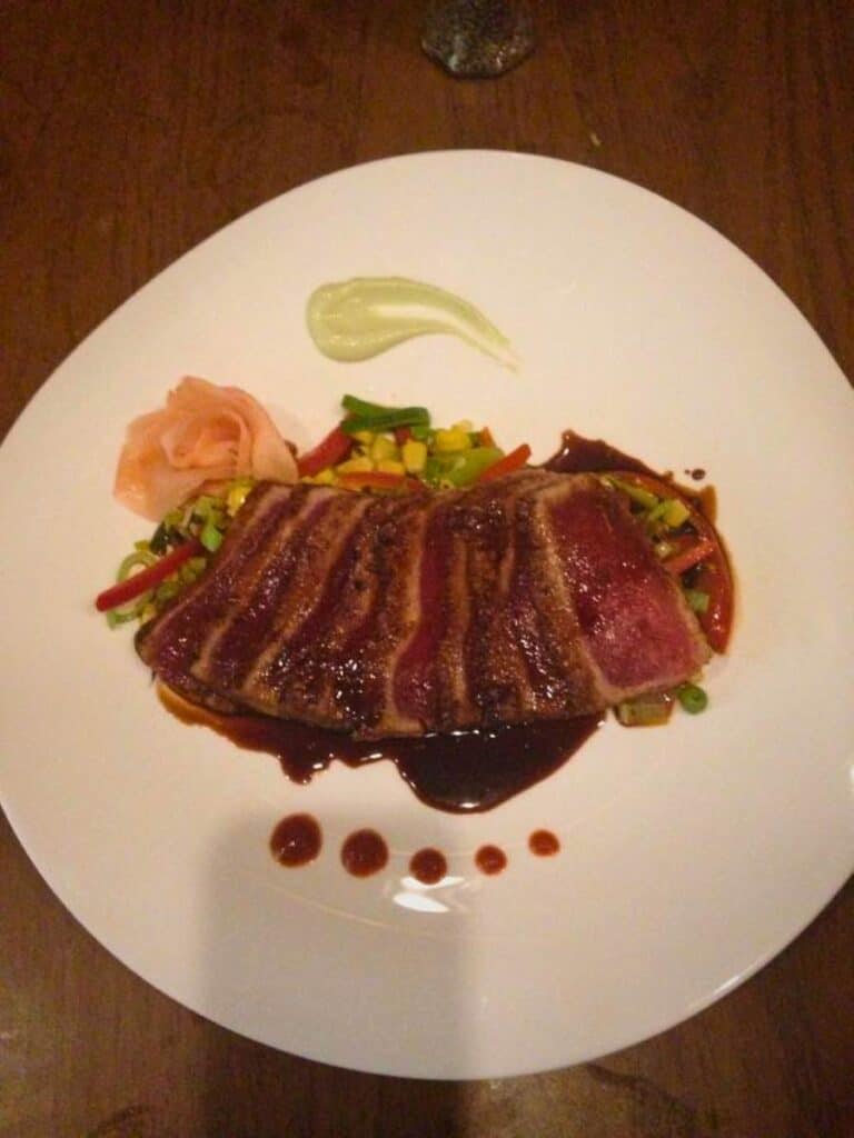 Seared rare tuna with vegetables at Phoenicia Gourmet, where to eat in Ocean Springs, MS for Mediterranean food.