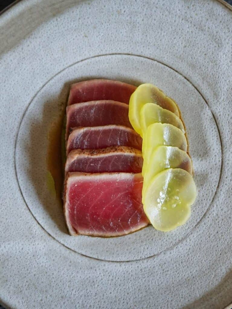 Elegant plated dish at Vestige with artistic presentation, highlighting fine dining among the best restaurants in Ocean Springs.