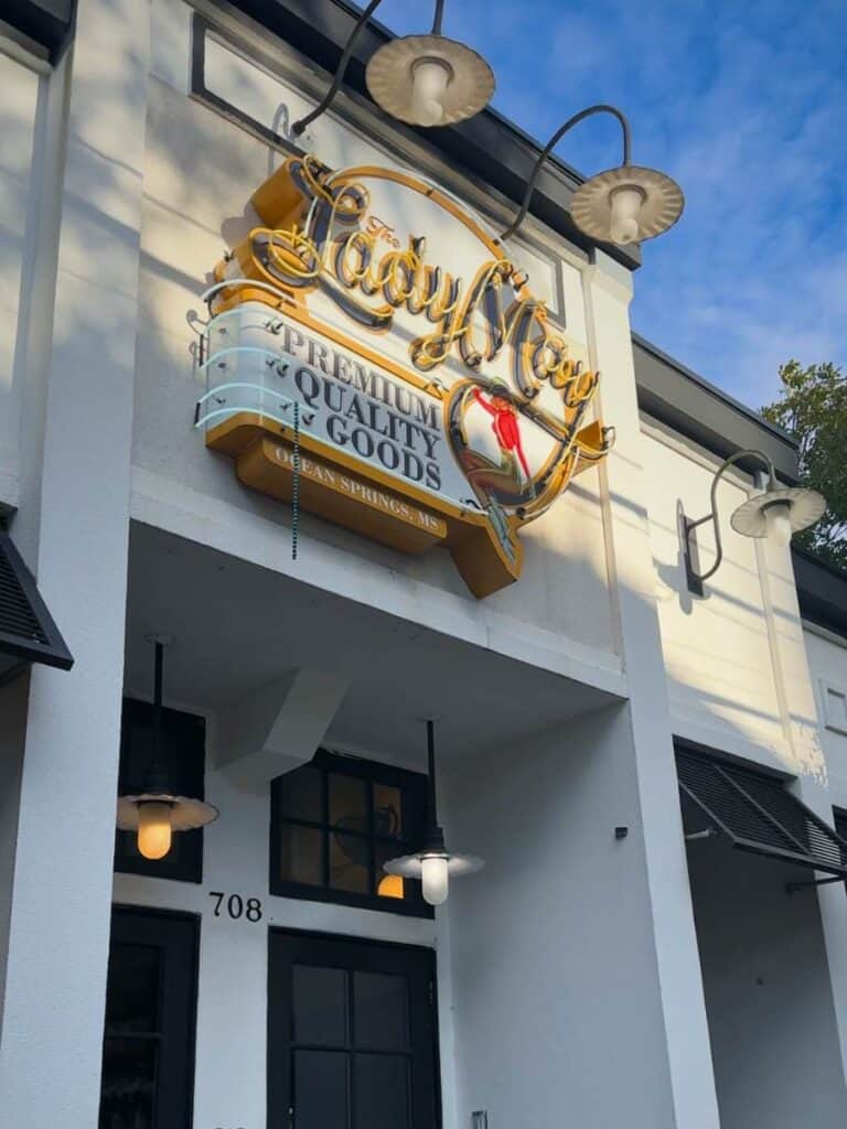 The neon Lady May sign glows over the entrance, marking one of the best restaurants in Ocean Springs, MS downtown.
