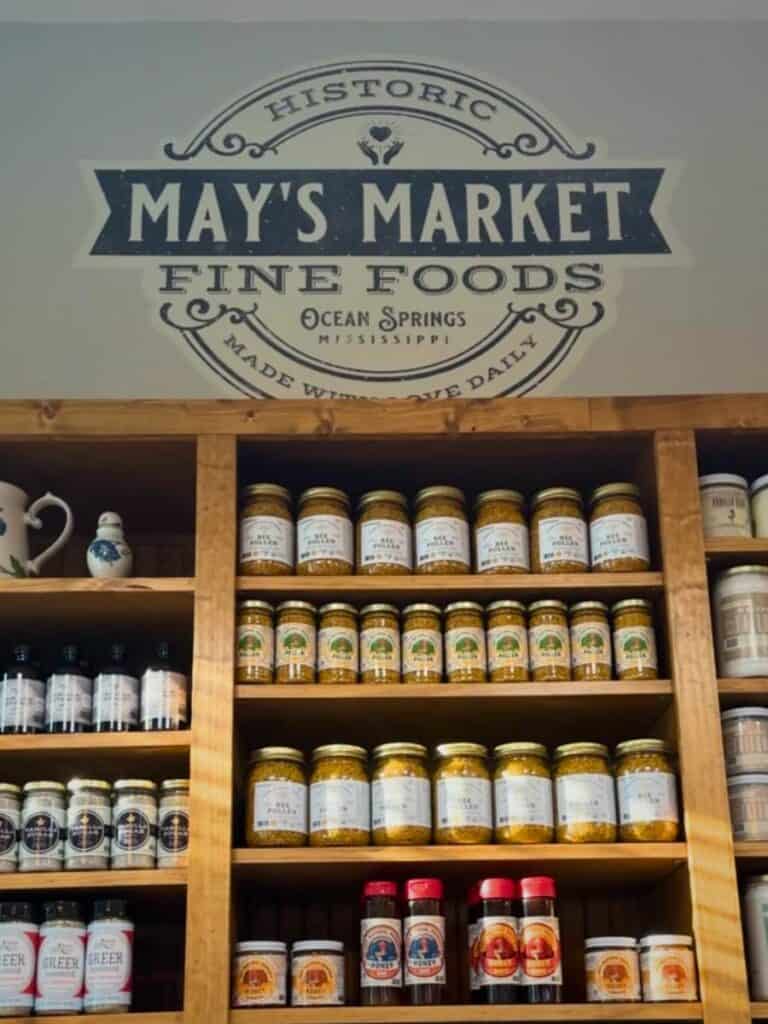 Shelves of house-made jams and hot sauce at May's Market, a fun add-on to lunch in Ocean Springs at The Lady May.