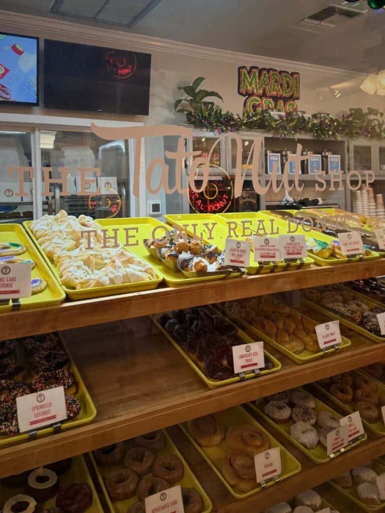 Bakery display filled with donuts behind glass with signage reading “The Only Real Donut”, showcasing a must visit stop for where to eat in Ocean Springs MS.