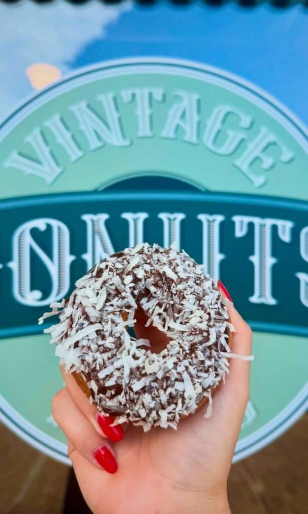 Chocolate glazed donut with coconut flakes at Vintage Donuts.