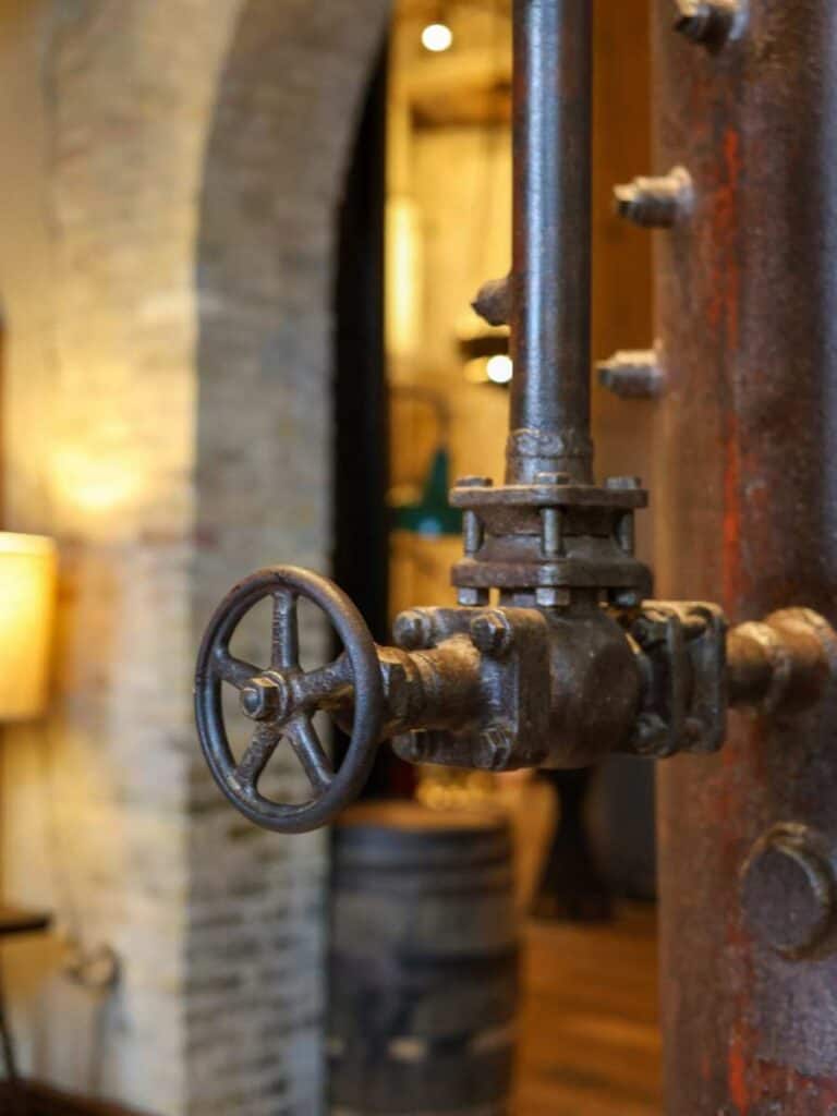 Vintage brewery valve and pipe kept as decor at Hotel Emma, a nod to the building's Pearl past
