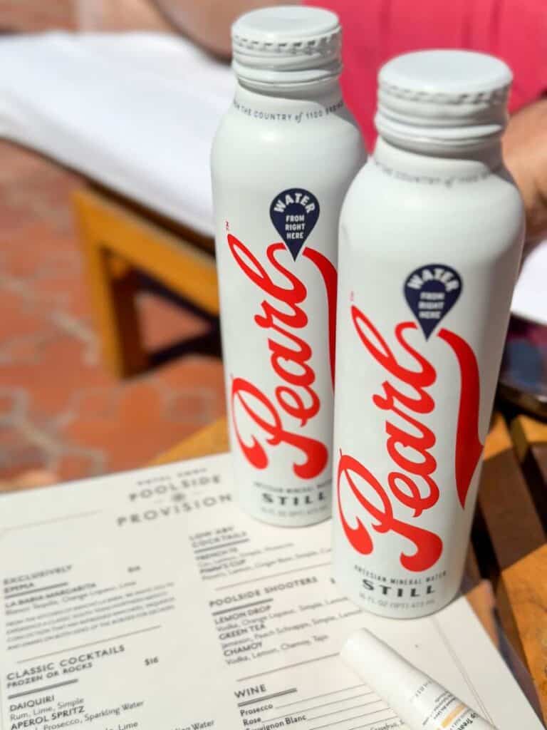 Two Pearl water bottles on the Poolside Provisions menu, where Hotel Emma prices its craft cocktails