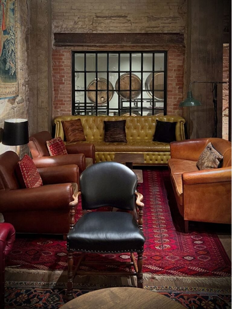 Sternewirth seating at Hotel Emma with a window to the original brewery fermentation tanks