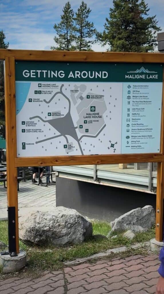 Map sign titled "Getting Around Maligne Lake" showing paths and key locations near the dock.