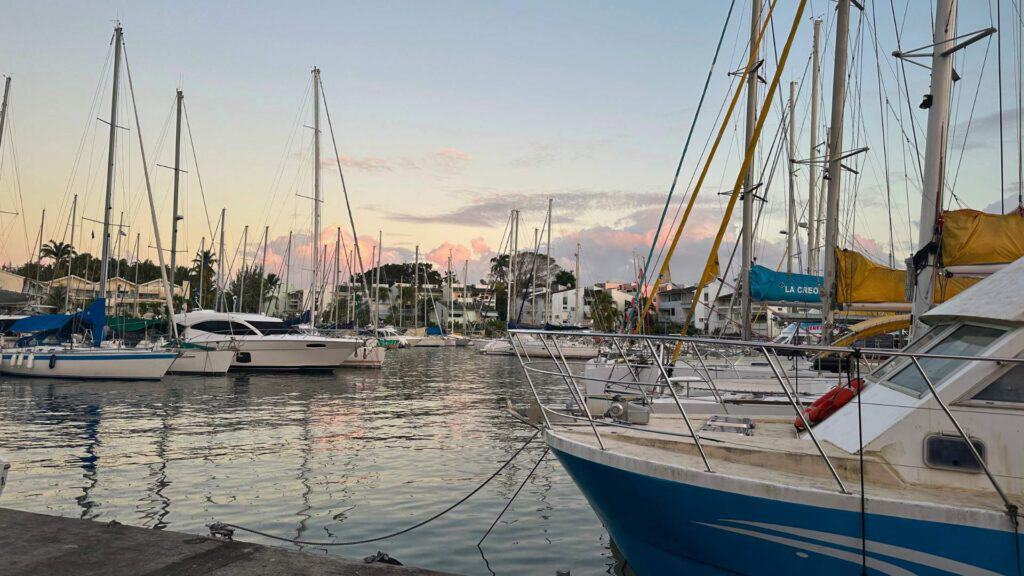 Sailboats moored at Pointe du Bout marina close to where to stay in Martinique for water activities