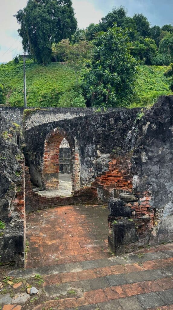Stone ruins with an arched doorway in northern Martinique close to vacation rentals in Martinique