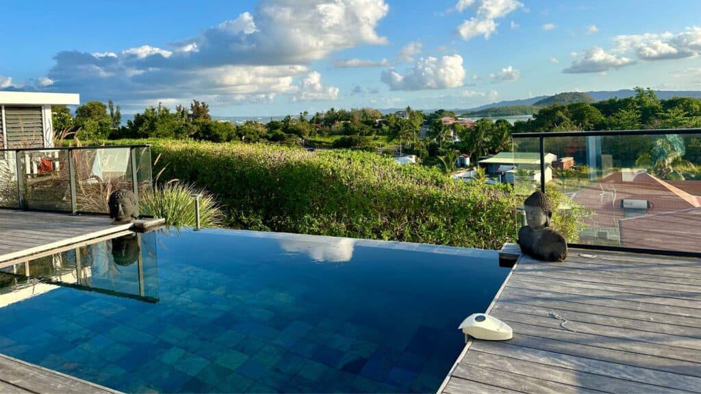 Infinity pool overlooking the Caribbean Sea at one of the most scenic places to stay in Martinique