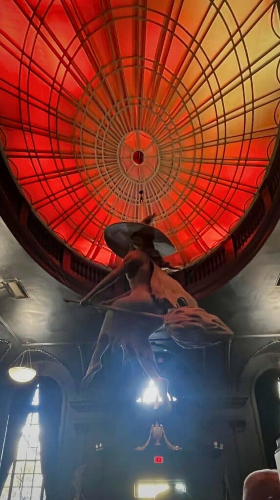 The red glow of a spinning light fixture inside a Salem haunted attraction
