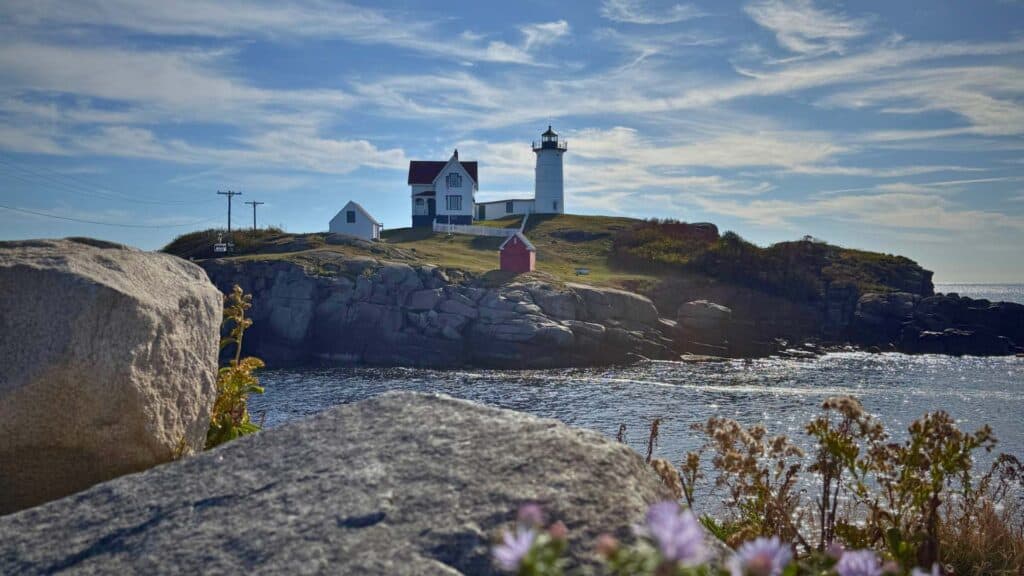 Cape Neddick Lighthouse, also known as Nubble Light, rises from its rocky island
