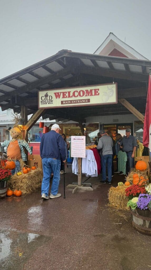 Vendors and shoppers gather under the welcome tent at Cold Hollow Cider Mill
