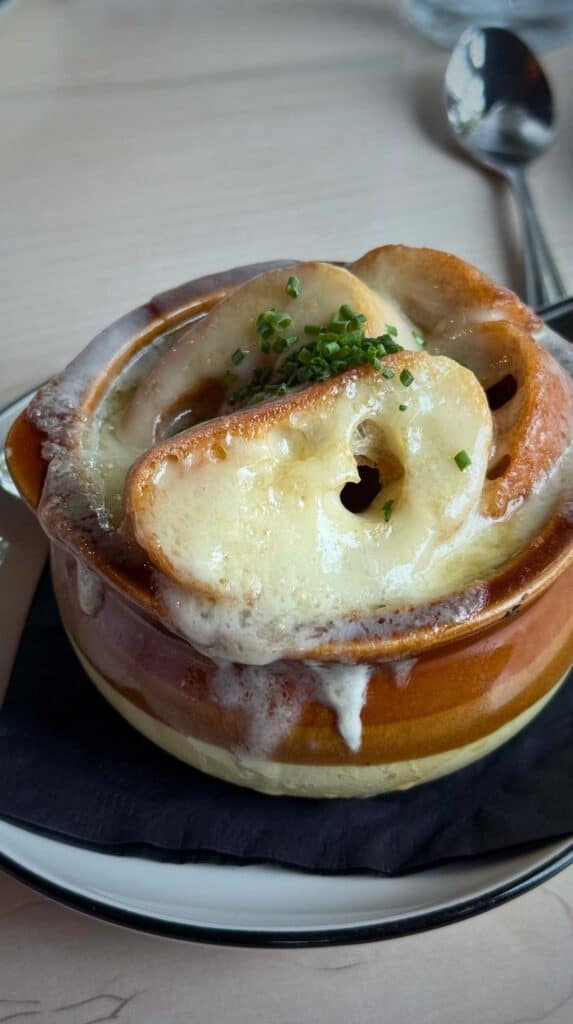 A bowl of French onion soup with melted cheese at Idletyme Brewery
