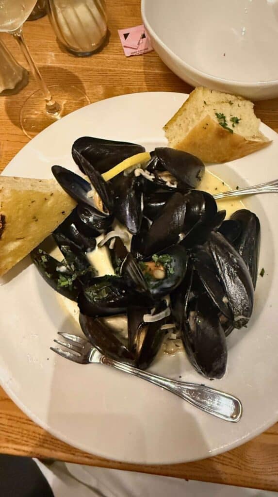 Steamed mussels and bread served at a restaurant in Stowe, Vermont

