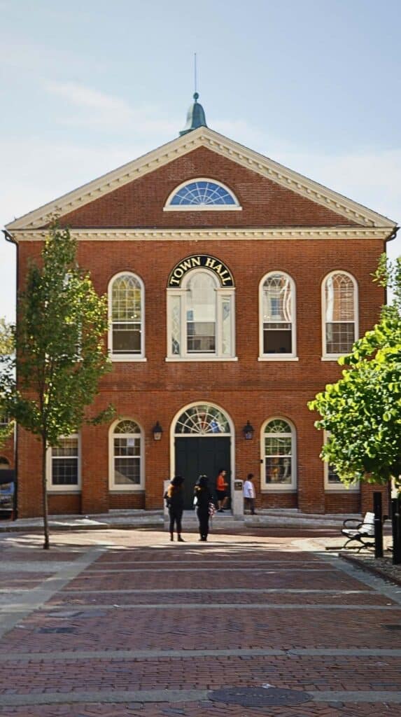 Salem's Old Town Hall stands over a brick courtyard on a sunny afternoon
