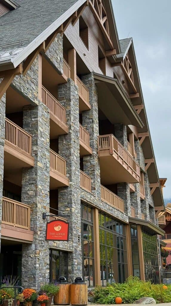 The stone and timber exterior of The Lodge at Spruce Peak in Stowe, Vermont
