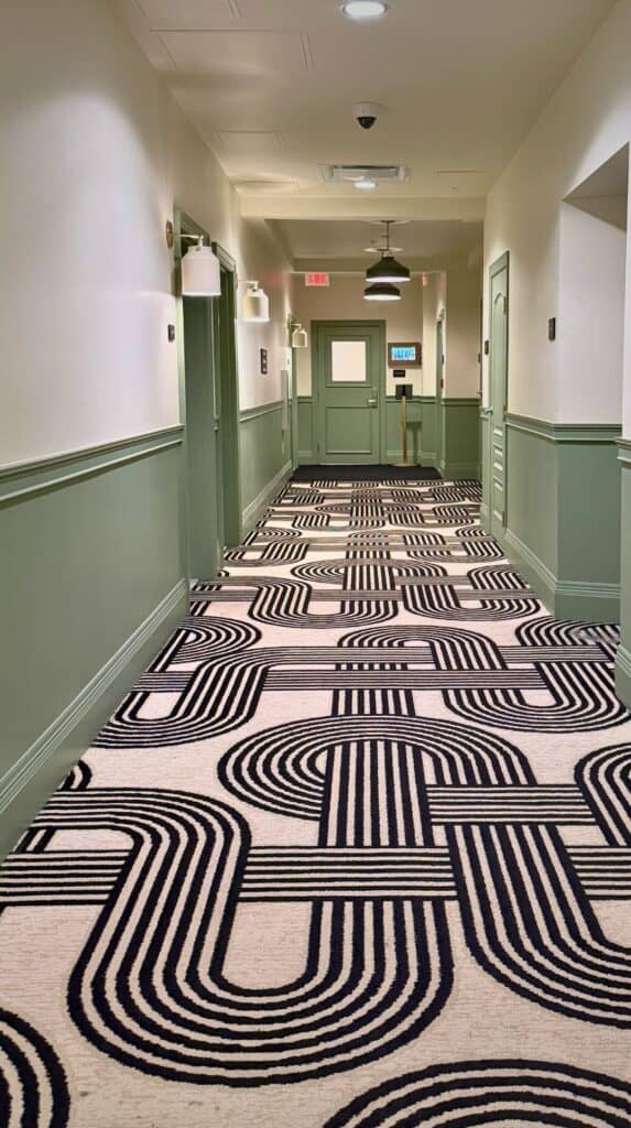 One of the coolest hotels Colorado Springs has, with a green corridor and bold black and white patterned carpet.
