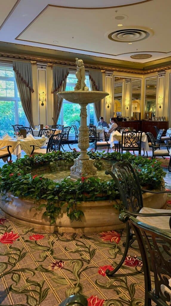 An ornate center fountain and floral carpet in the Lake Terrace Dining Room
