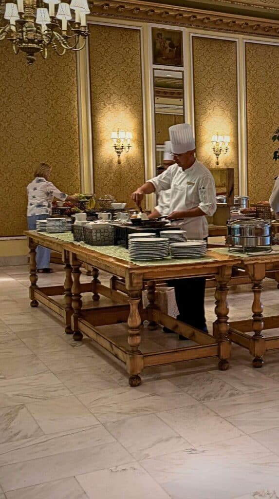 A chef working a cooking station during Sunday brunch at the Lake Terrace Dining Room