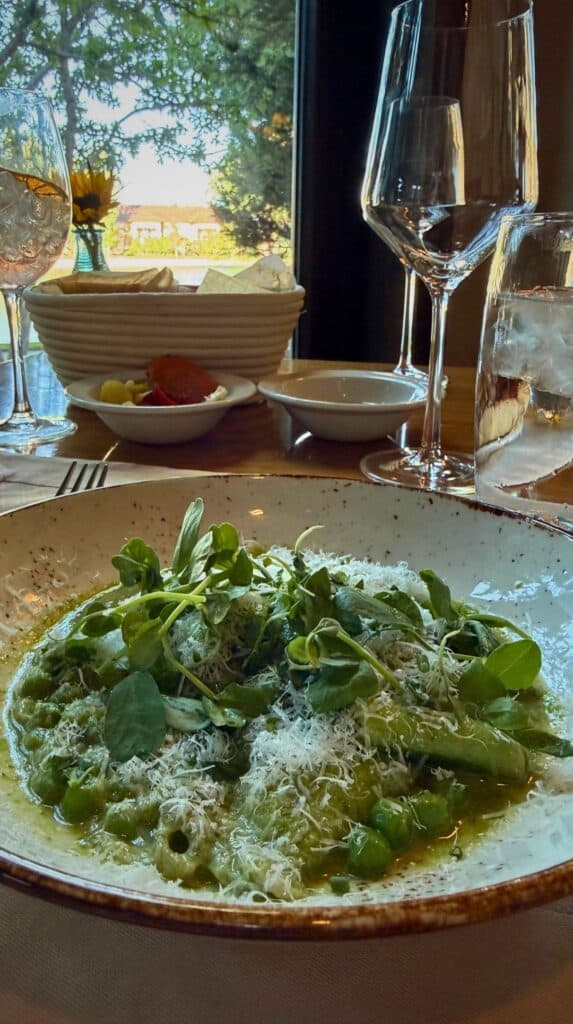 Green sweet pea pasta with parmesan and pea shoots, a standout plate from our Broadmoor dining picks