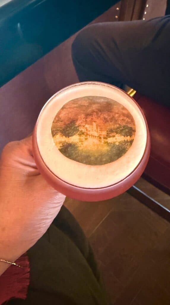 Broadmoor Clover Club cocktail with the Broadmoor crest printed on the egg-white foam at the Penrose Lounge