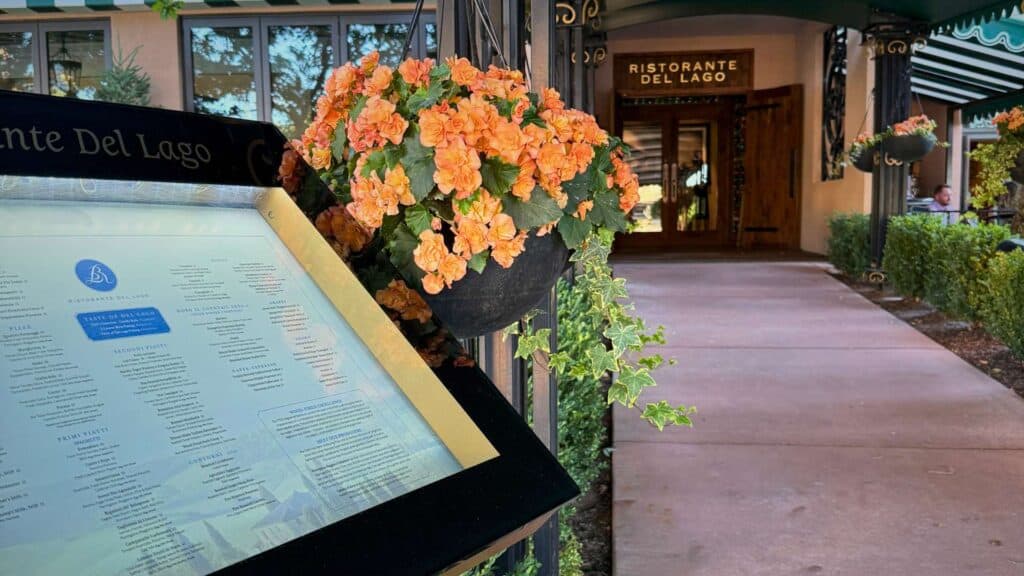 Menu board and orange flower baskets at the entrance to Ristorante del Lago at The Broadmoor